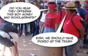 Sakeman van Pretoria gee student wat EFF-Rommel optel tydens protestaksie op die kampus van die Universiteit van die Vrystaat, ’n beurs